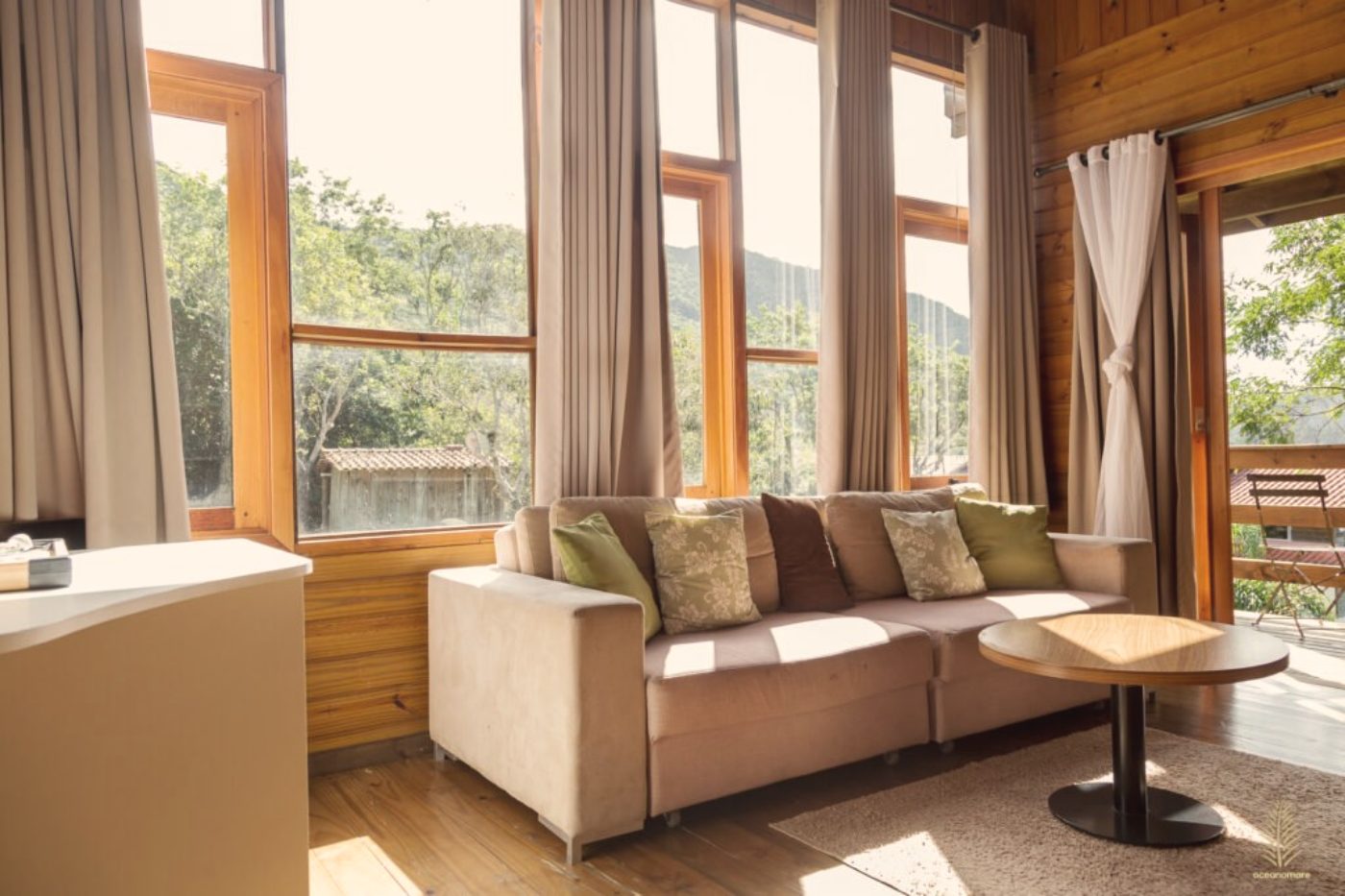 Chalet living room looking onto the forest